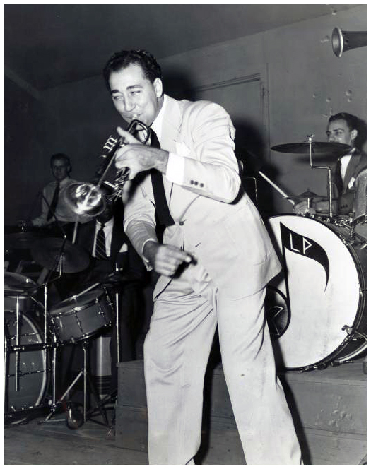 COURTESY OF THE NEW ORLEANS JAZZ MUSEUM. Photo of the Louis Prima Band, the first band with Irving Fazola, from left to right: Louis Prima, Ewell Lamar, (?), Irving Fazola, Johnny Viviano, (?).
