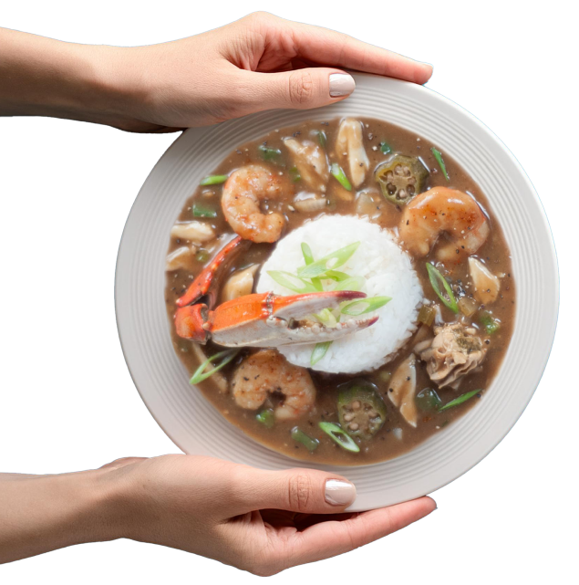 Hands Holding a Dish of Louisiana Seafood Gumbo