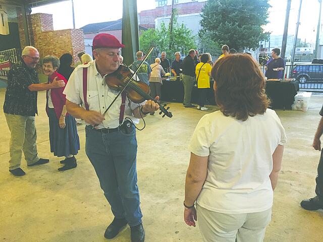 Cajun dancing and Cajun food are highlights of the Saturday night party