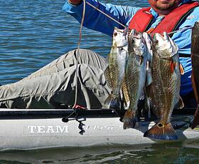 Catching fish from a kayak in Grand Isle, Louisiana