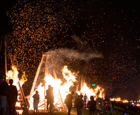 A huge bonfire burns in the night during the Festival of Bonfires in Louisiana.