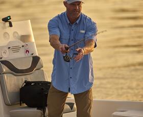 A man casts a line while fishing in Louisiana.