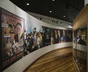 Interior of the Eddie G. Robinson Museum featuring historic photos and memorabilia displays.