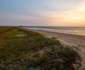 Grand Isle beach at sunset.